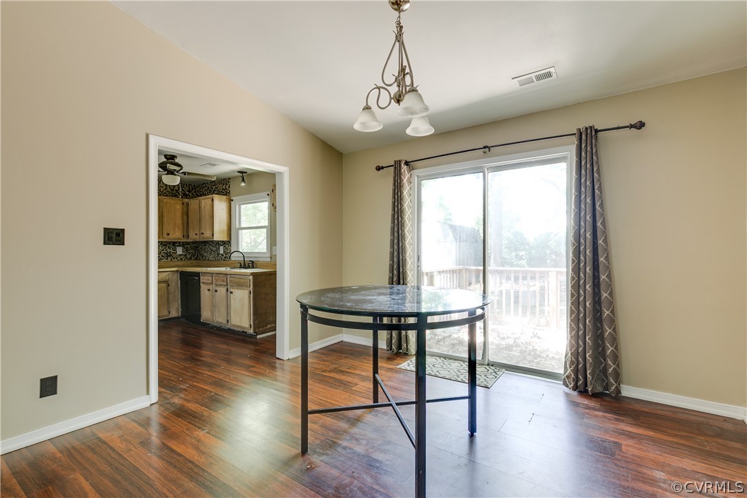 6430 Jessup Road Chesterfield, VA 23832 - Photo 9 of 26 a view of a dining room with furniture window and wooden floor