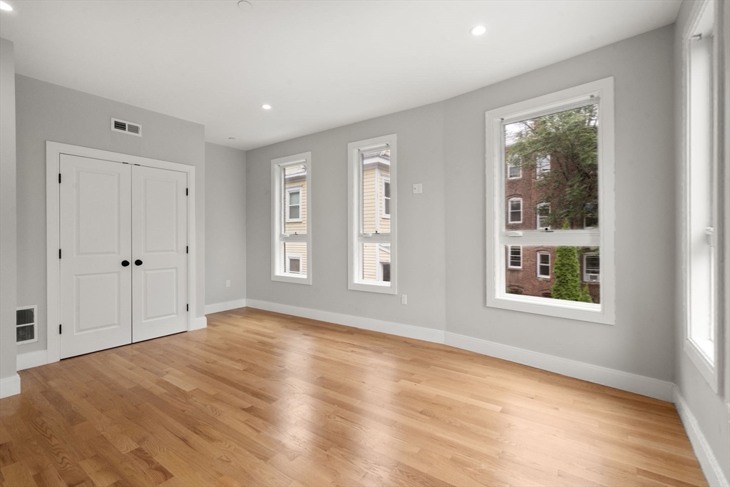 123-125 Centre Street, Unit TH7 Boston, MA 02124 - Photo 20 of 37 a view of an empty room with a window