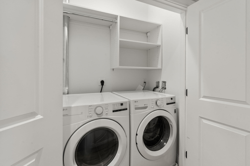 123-125 Centre Street, Unit TH7 Boston, MA 02124 - Photo 21 of 37 a utility room with dryer and washer