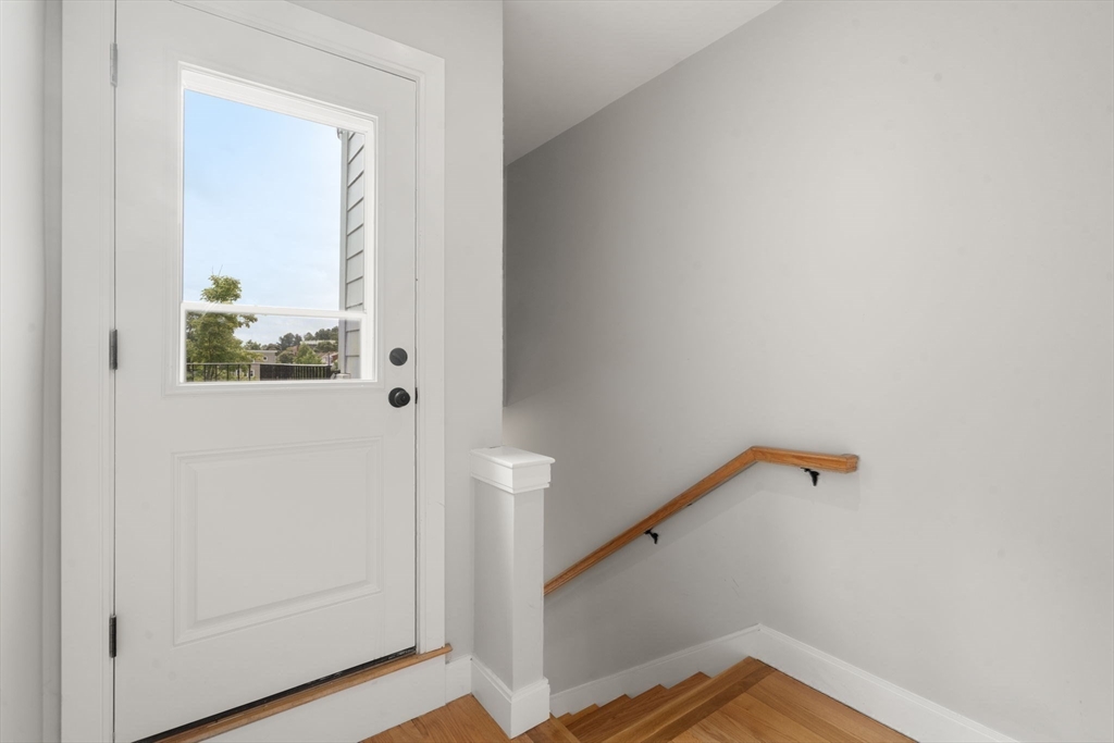 123-125 Centre Street, Unit TH7 Boston, MA 02124 - Photo 25 of 37 a view of a hallway with entryway