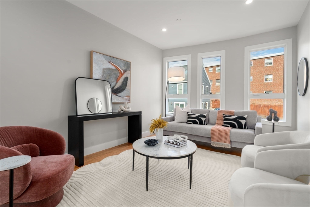 123-125 Centre Street, Unit TH7 Boston, MA 02124 - Photo 4 of 37 a living room with furniture