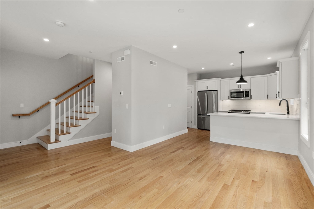 123-125 Centre Street, Unit TH7 Boston, MA 02124 - Photo 10 of 37 a view of kitchen with wooden floor