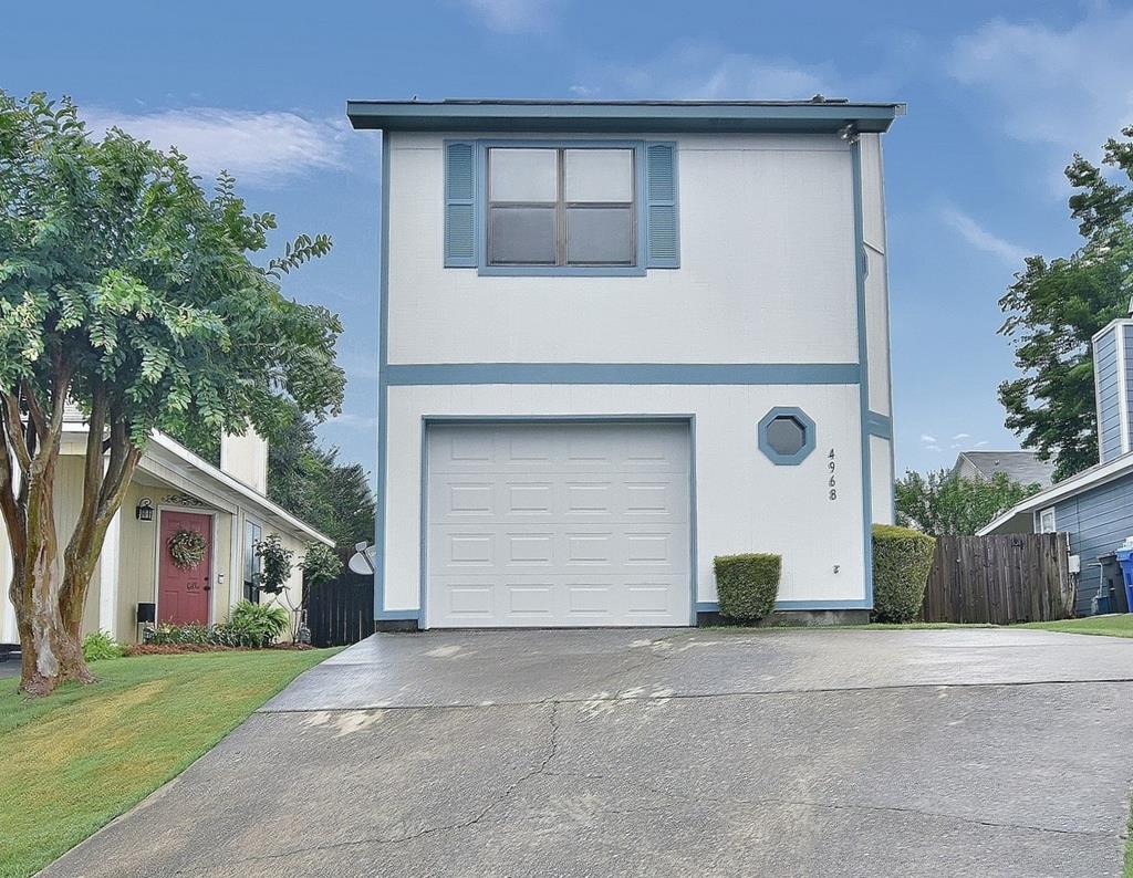 4968 Daybreak Lane Columbus, GA 31909 - Photo 1 of 24 a front view of a house with a yard and garage