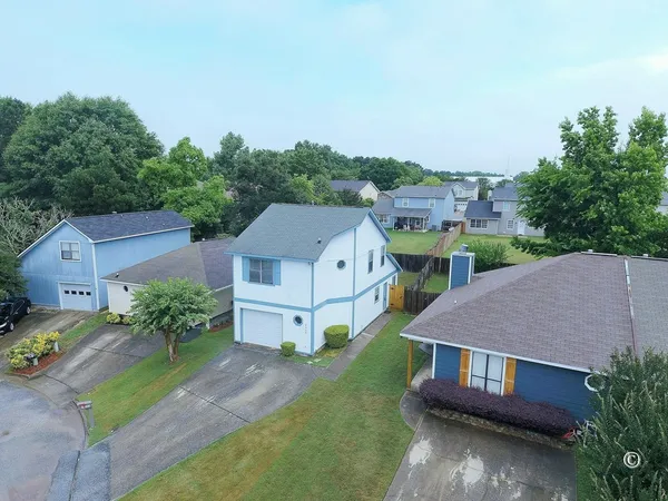 an aerial view of a house with a garden