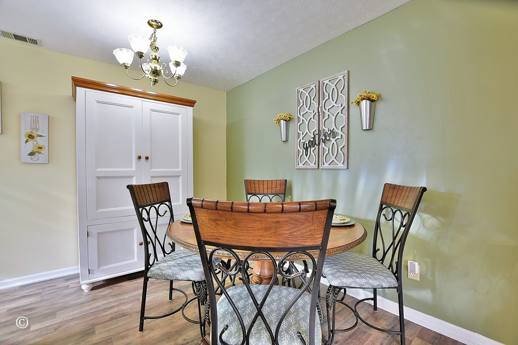 4968 Daybreak Lane Columbus, GA 31909 - Photo 6 of 24 a view of a dining room with furniture and chandelier