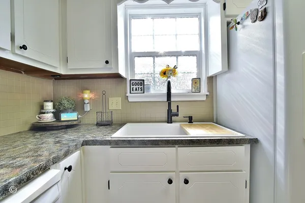 a kitchen with a sink and a window