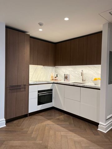 a kitchen with stainless steel appliances granite countertop a refrigerator and a stove