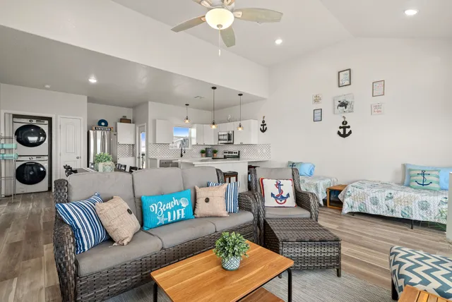 a living room with furniture and a chandelier