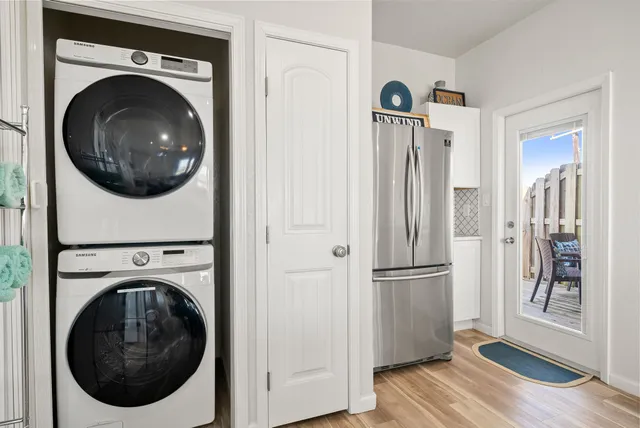 a view of a hallway with washer and dryer