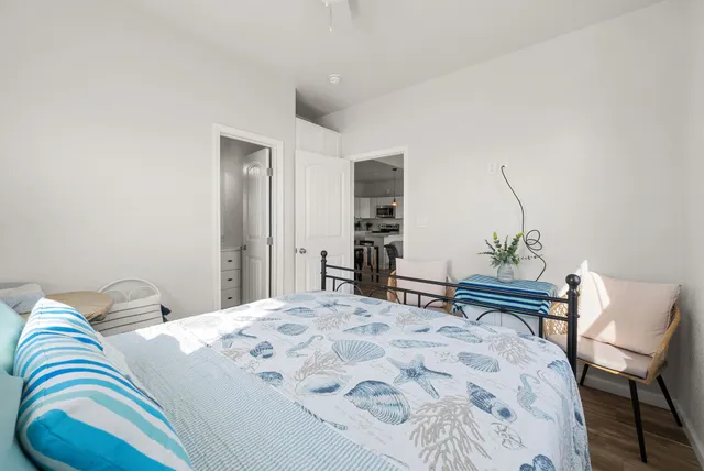 a bedroom with a bed and a chair