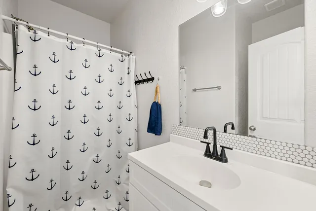 a bathroom with a sink and a mirror