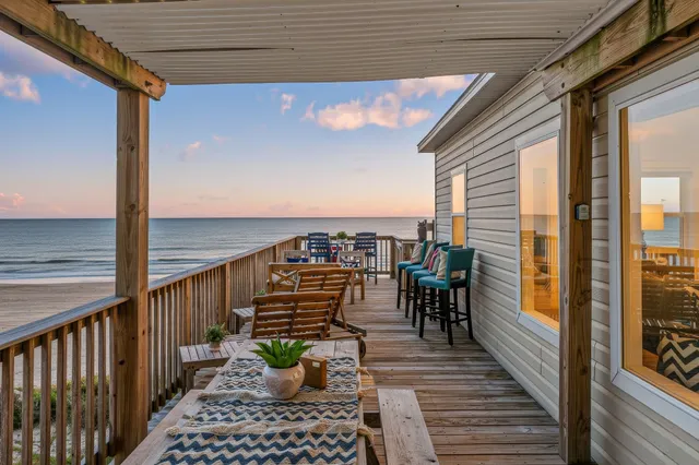 a view of a balcony with chairs