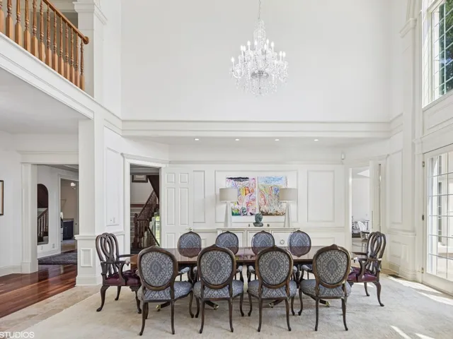 a view of a livingroom with furniture and hardwood floor