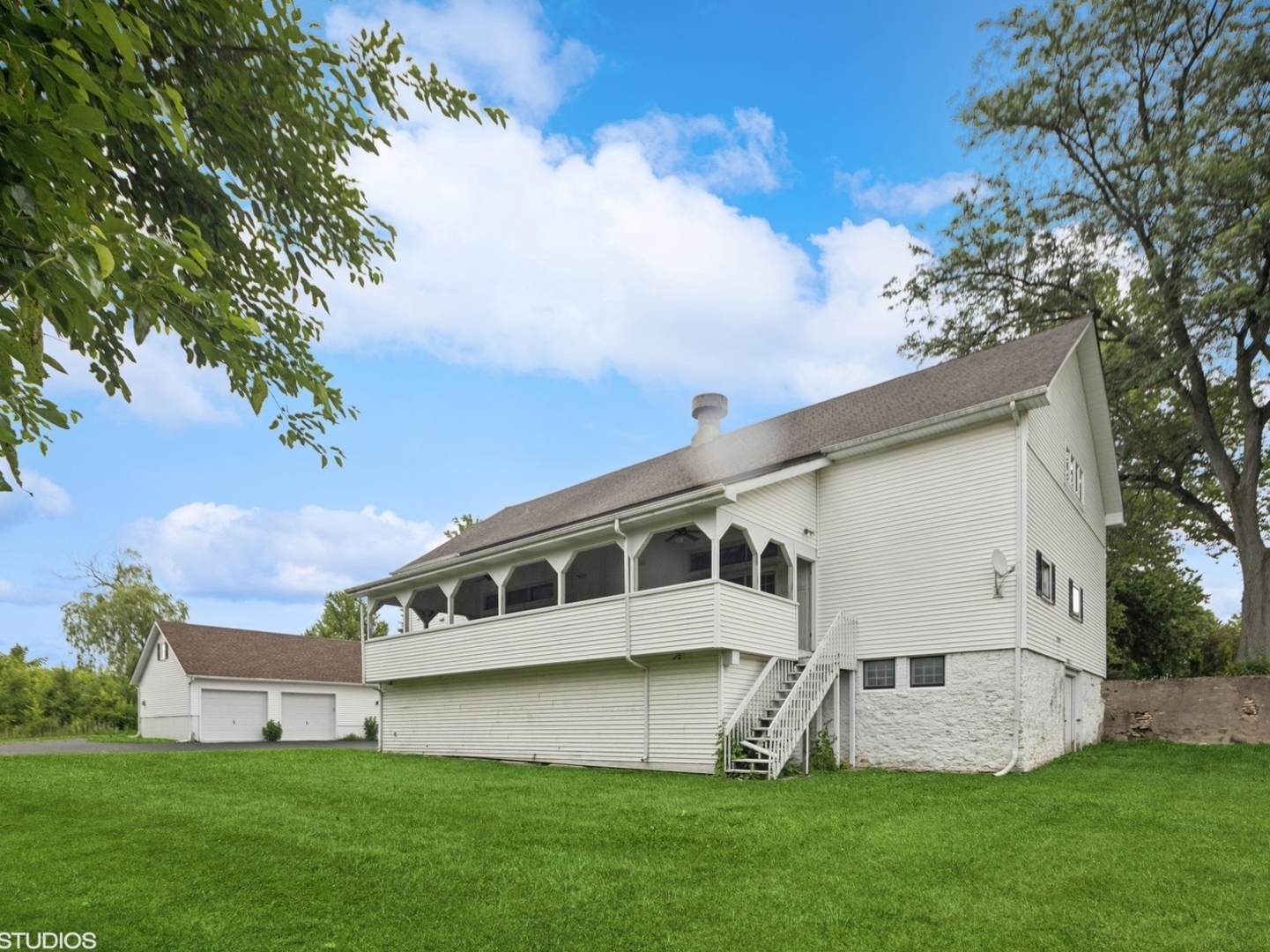 5-n113 Burr Road St. Charles, IL 60175 - Photo 128 of 130 a view of house with backyard