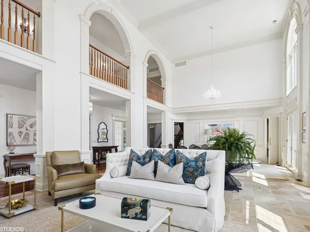 a bathroom with a granite countertop sink and a window