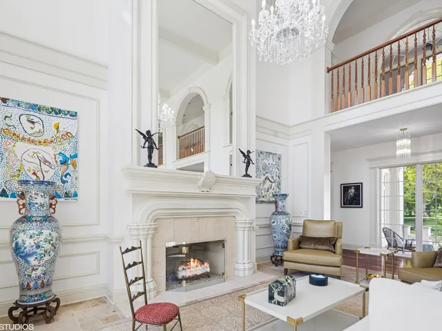 a bathroom with a granite countertop sink a large mirror and a window