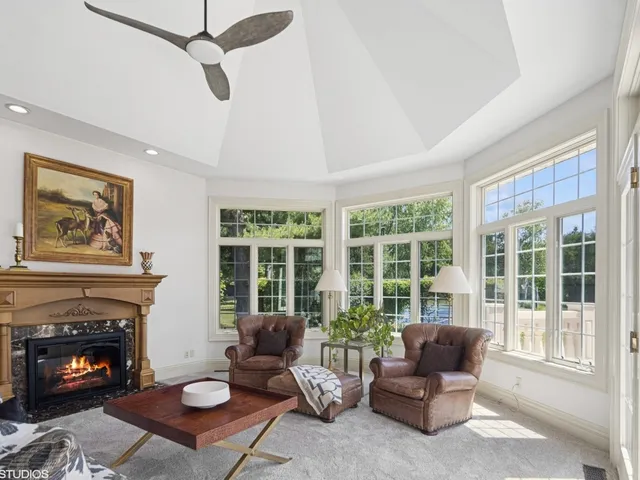 a living room with furniture and a bed