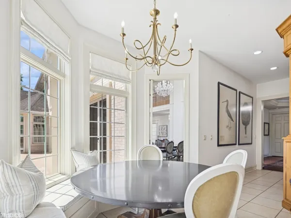 a dining room with furniture and window