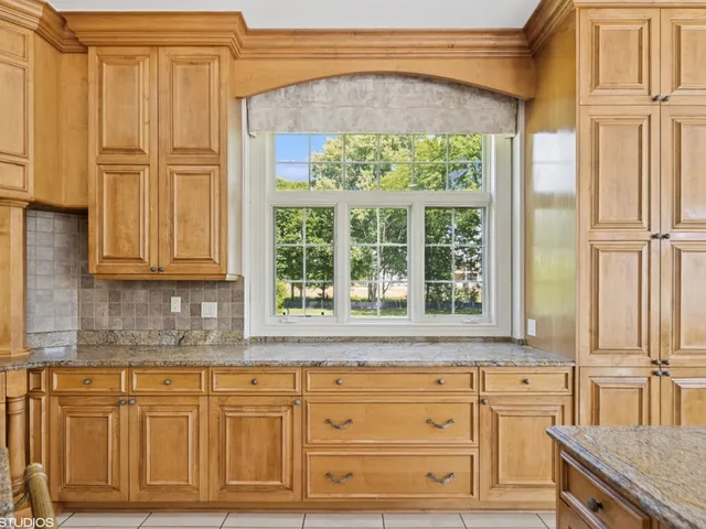 a living room with furniture flowerpot and a window