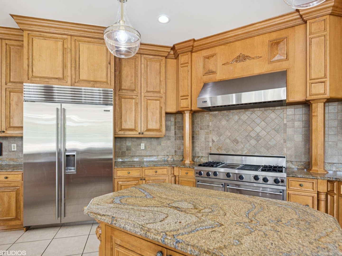 5-n113 Burr Road St. Charles, IL 60175 - Photo 20 of 130 a kitchen with stainless steel appliances granite countertop a stove a sink and a refrigerator