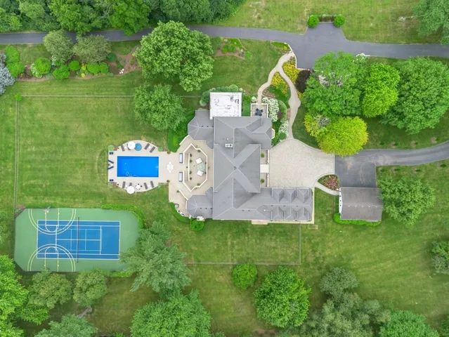 a view of a house with swimming pool and sitting area
