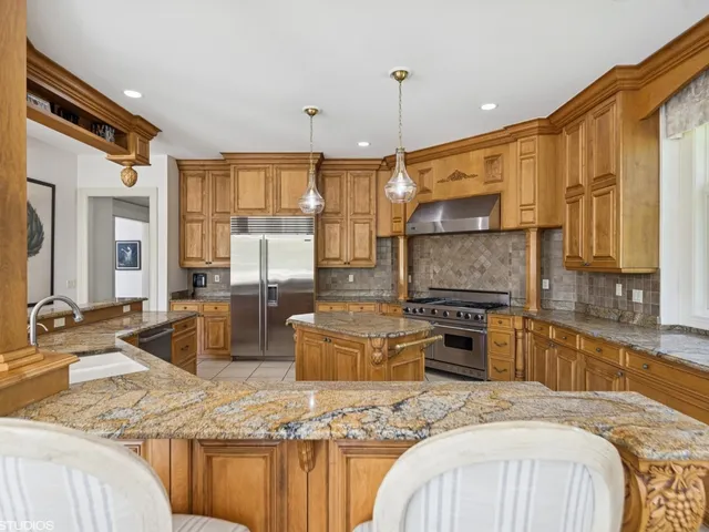 a bathroom with a double vanity sink mirror and toilet