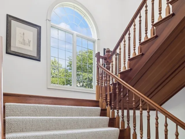 a bathroom with a tub and a window
