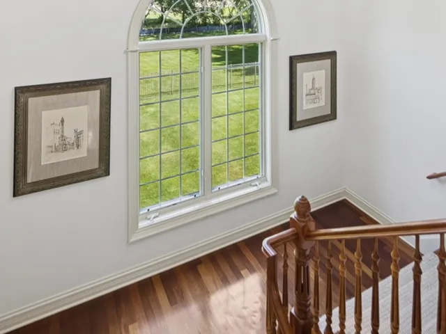 a spacious bathroom with a double vanity sink a mirror and a shower