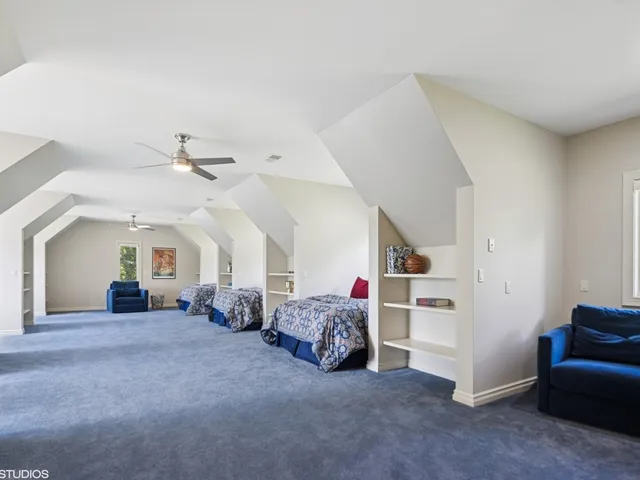 a view of a hallway with paintings on the wall