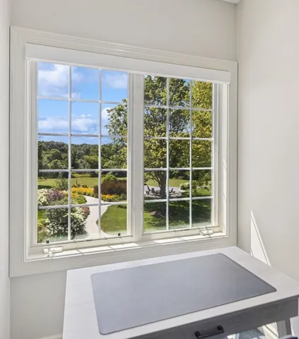 a dining room with furniture and window