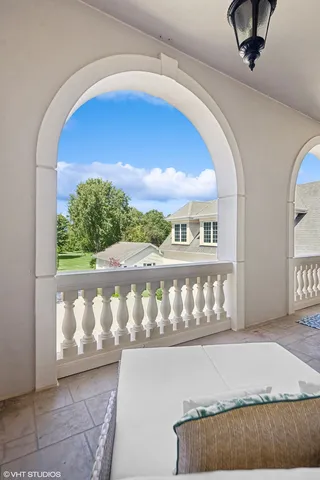 a view of a house with pool and chairs