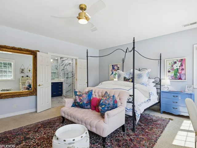 a view of a park with a bench and a fountain