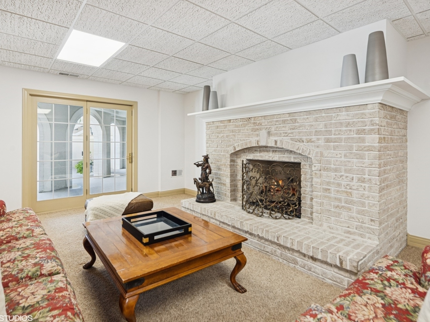5-n113 Burr Road St. Charles, IL 60175 - Photo 90 of 130 a living room with furniture and a fireplace