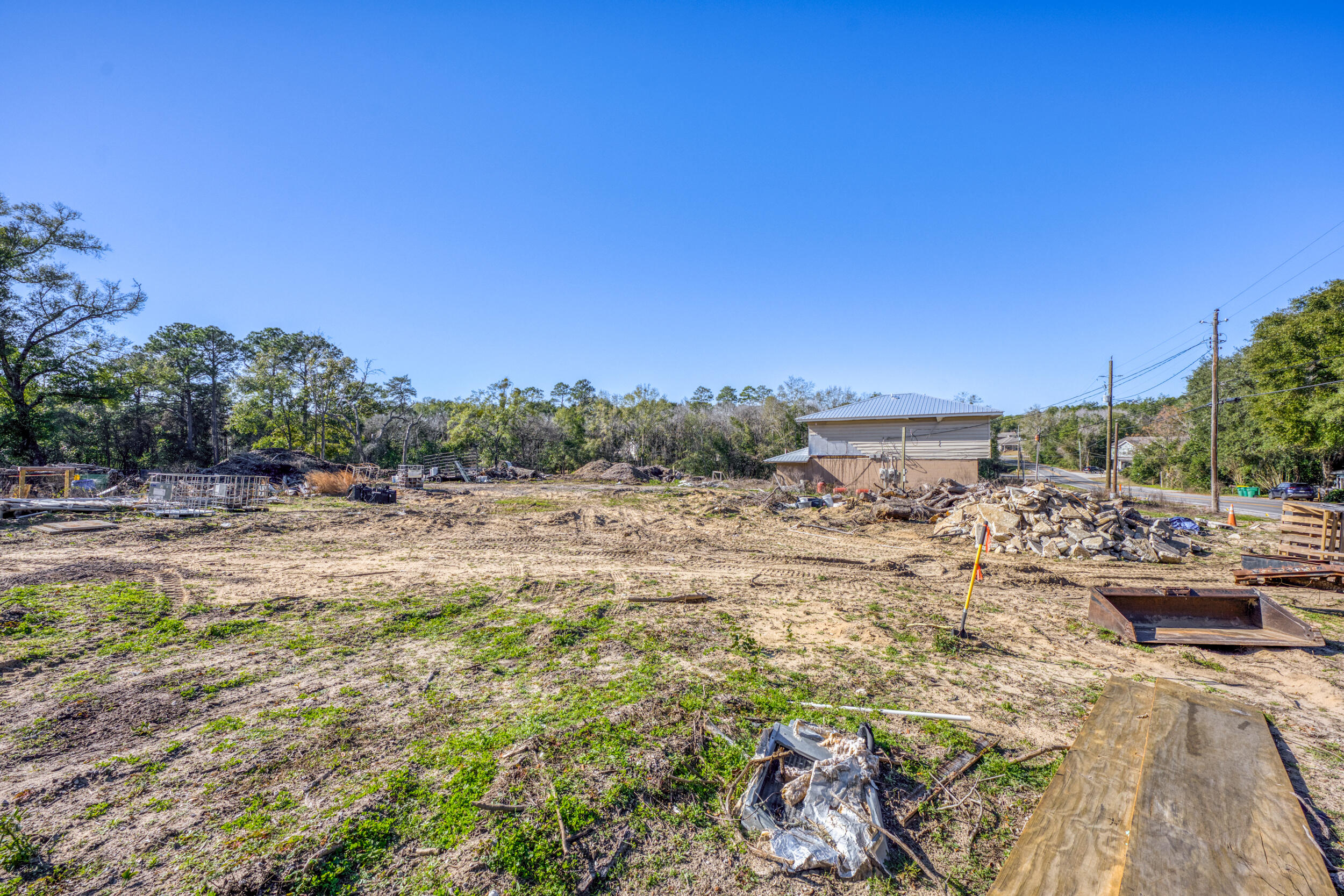 309 Kelly Road Niceville, FL 32578 - Photo 3 of 8 a view of a lake with a car parked in the background