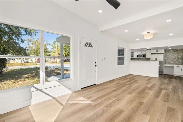 a view of a kitchen with a sink and cabinets