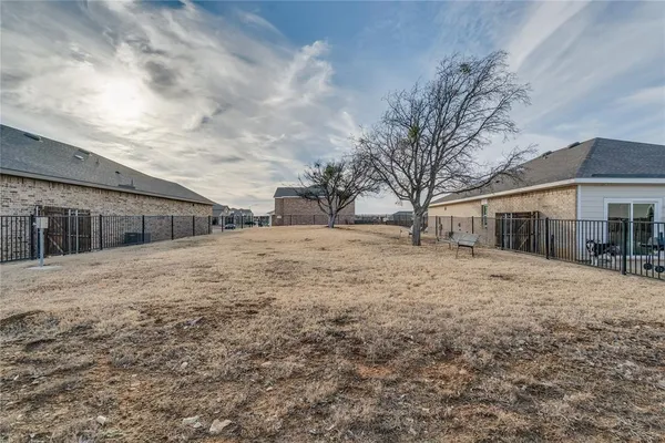 a backyard of a house with large trees