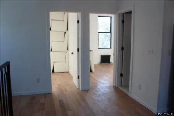 a view of entryway with wooden floor