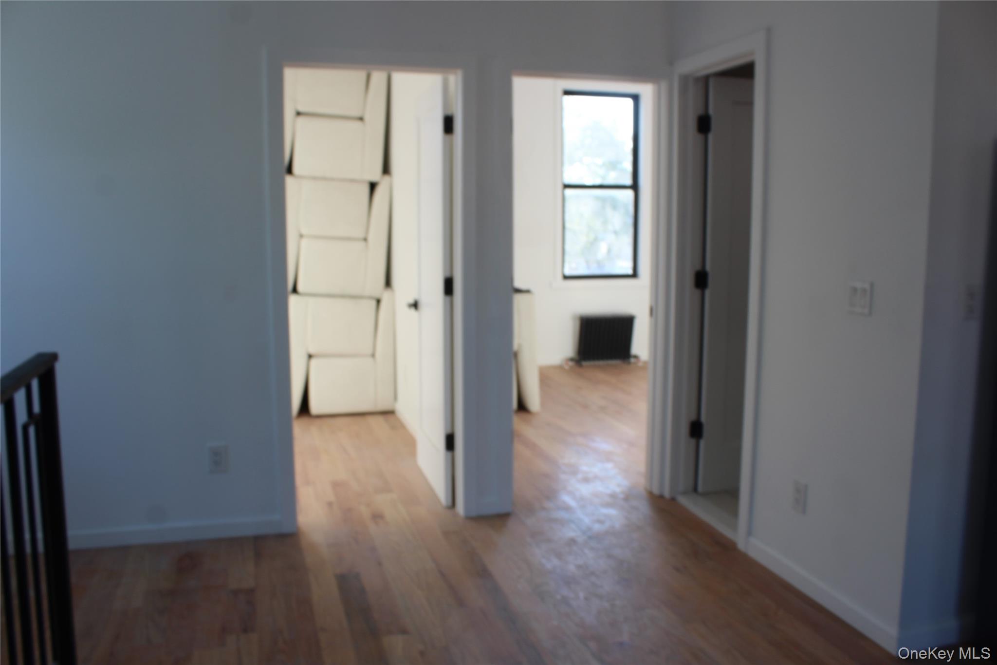 816 Barbey Street, Unit 2 Brooklyn, NY 11207 - Photo 11 of 11 a view of entryway with wooden floor