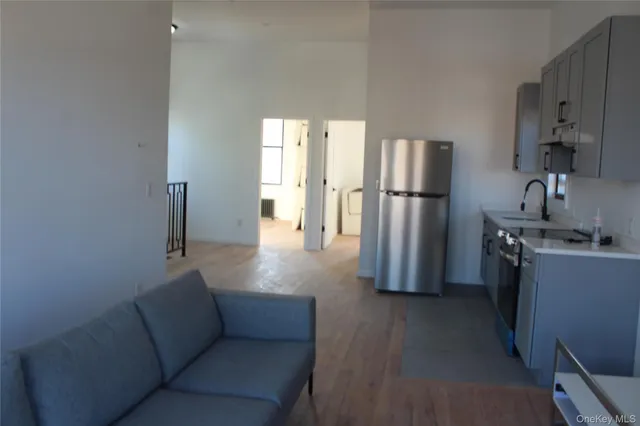 a kitchen with refrigerator and window