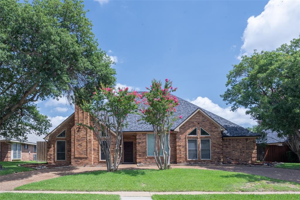 3905 Cross Bend Road Plano, TX 75023 - Photo 1 of 27 a front view of a house with a garden