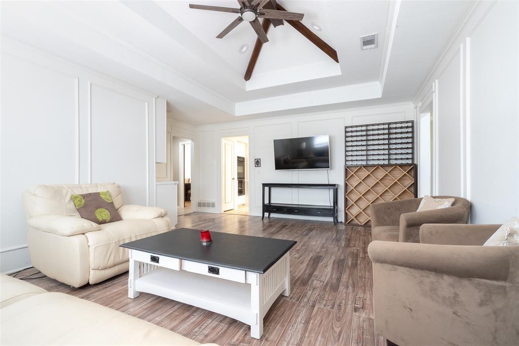 3905 Cross Bend Road Plano, TX 75023 - Photo 13 of 27 a living room with furniture and a flat screen tv