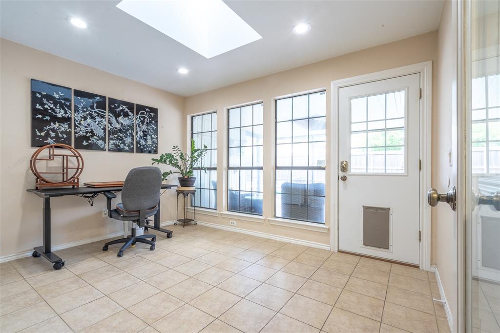 3905 Cross Bend Road Plano, TX 75023 - Photo 15 of 27 a view of a workspace with furniture and a window