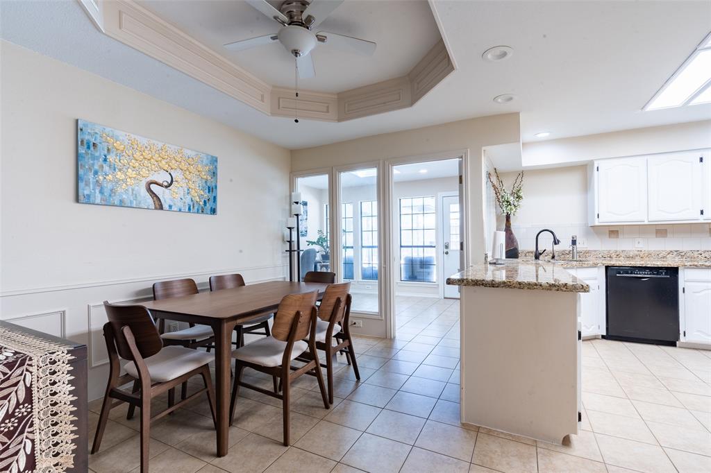 3905 Cross Bend Road Plano, TX 75023 - Photo 17 of 27 a view of a dining room with furniture and a chandelier