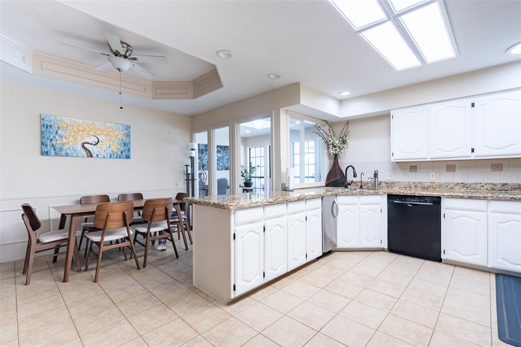 3905 Cross Bend Road Plano, TX 75023 - Photo 18 of 27 a kitchen with cabinets and chairs