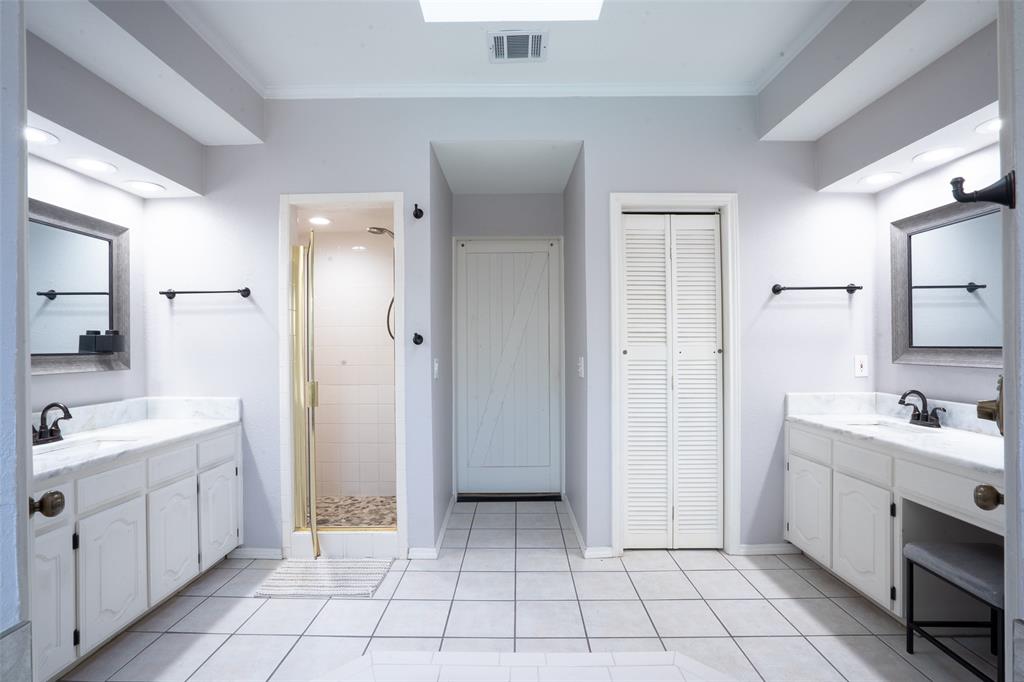 3905 Cross Bend Road Plano, TX 75023 - Photo 20 of 27 a spacious bathroom with a double vanity sink a mirror and a