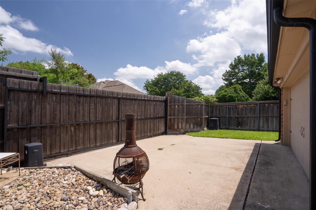 3905 Cross Bend Road Plano, TX 75023 - Photo 26 of 27 a view of a backyard with a slide