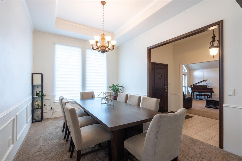 3905 Cross Bend Road Plano, TX 75023 - Photo 4 of 27 a view of a dining room with furniture window and wooden floor