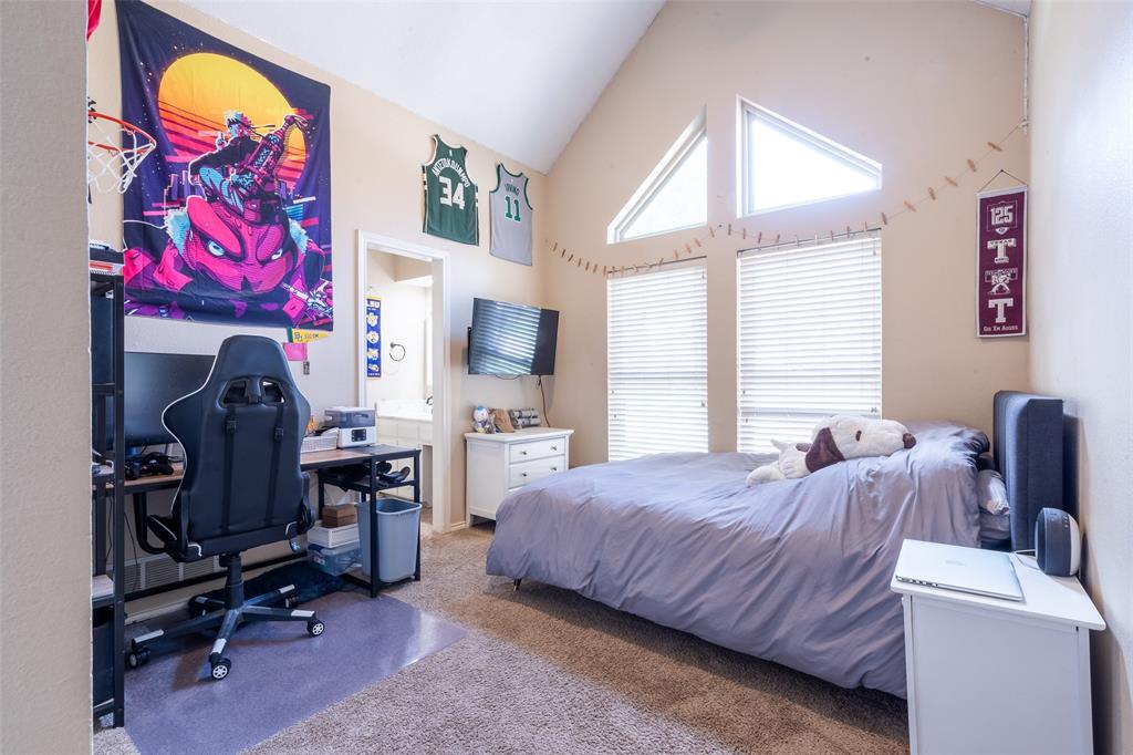 3905 Cross Bend Road Plano, TX 75023 - Photo 8 of 27 a bedroom with a bed and furniture