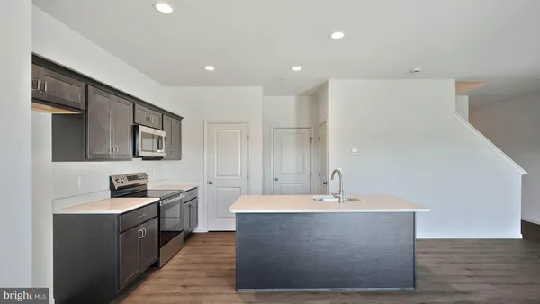 a large room with stainless steel appliances