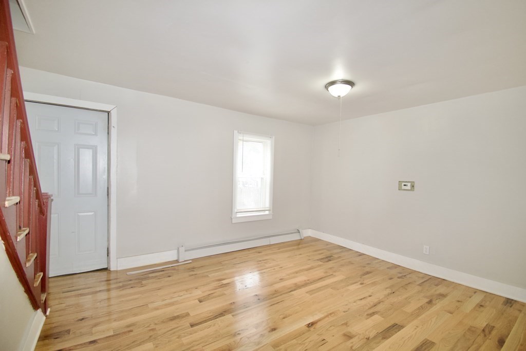 38 Collins Street Springfield, MA 01109 - Photo 12 of 39 a view of empty room with wooden floor and fan